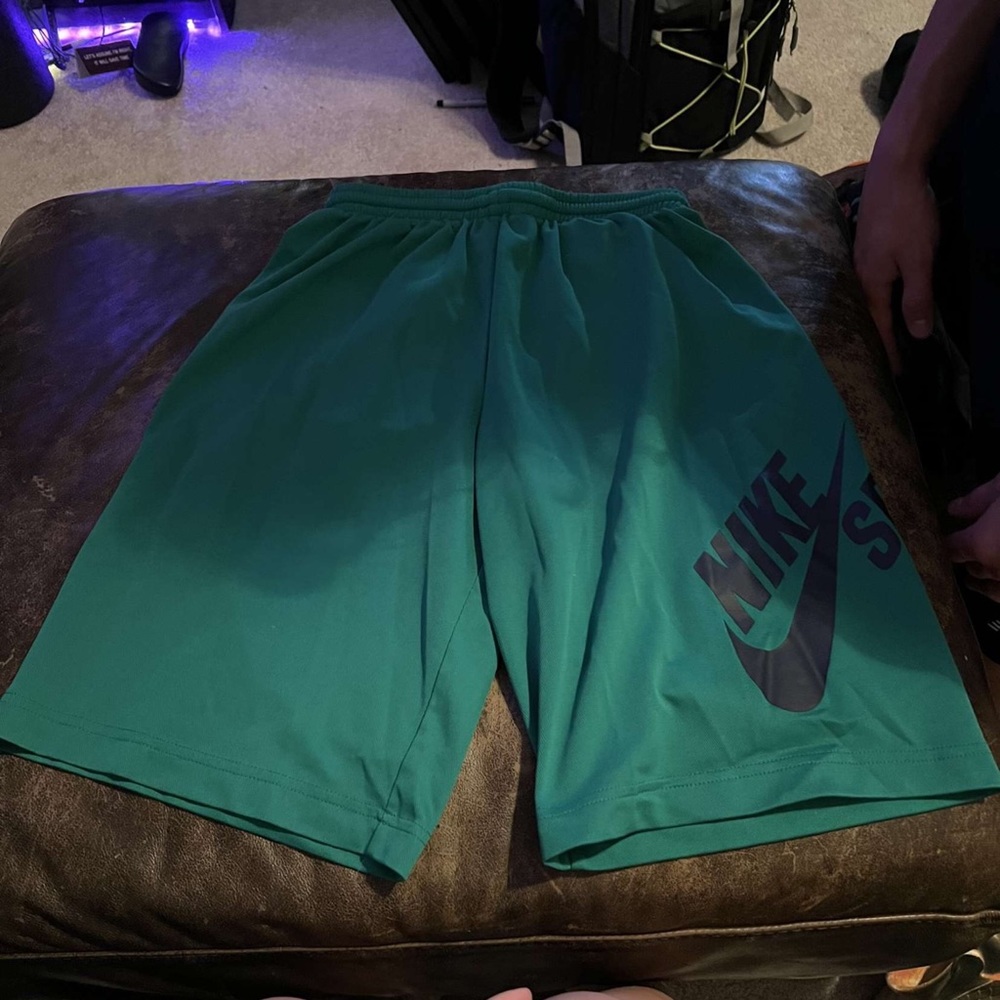 Boys green Nike shorts
